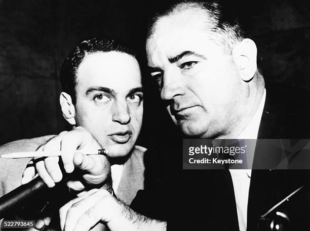 Attorney Roy Cohn talking to American senator Joseph McCarthy , circa 1954.