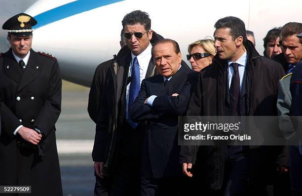 Italian Premier Silvio Berlusconi waits at Ciampino Rome airport for the arrival of freed Italian hostage Giuliana Sgrena, a day after she was...