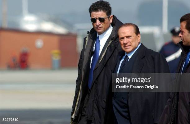 Italian Premier Silvio Berlusconi waits at Ciampino Rome airport for the arrival of freed Italian hostage Giuliana Sgrena, a day after she was...