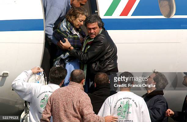 Freed Italian hostage Giuliana Sgrena is helped out of the plane at Ciampino airport a day after she was rescued from her Iraqi kidnappers March 5,...