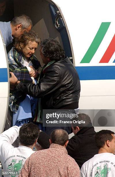 Freed Italian hostage Giuliana Sgrena is helped out of the plane at Ciampino airport a day after she was rescued from her Iraqi kidnappers March 5,...