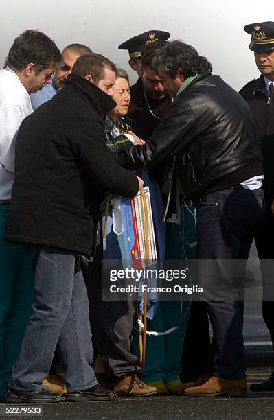 Freed Italian hostage Giuliana Sgrena is escorted to an ambulance at Ciampino airport a day after she was rescued from her Iraqi kidnappers March 5,...