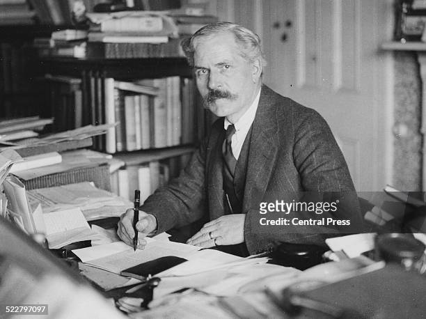 British Prime Minister James Ramsay MacDonald writing at his desk, London, December 3rd 1929.