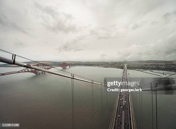 forth bridges from top of north tower of road bridge - firth of forth rail bridge stock pictures, royalty-free photos & images