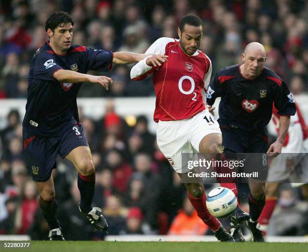 Thierry Henry of Arsenal takes on Dejan Stefanovic of Portsmouth during the Barclays Premiership match between Arsenal and Portsmouth at Highbury on...