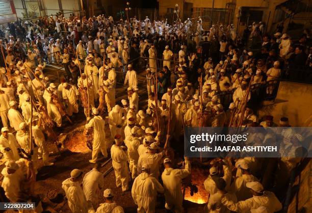 Samaritans take part in the traditional Passover sacrifice ceremony, where sheep and goats are slaughtered, at Mount Gerizim near the northern West...