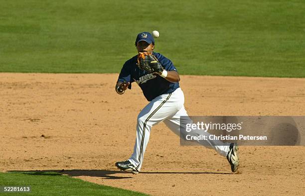 Prince Fielder of the Milwaukee Brewers fields the ball during the MLB spring training game against the Oakland Athletics at Maryvale Baseball Park...