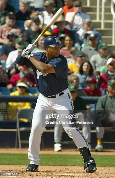Carlos Lee of the Milwaukee Brewers bats against the Oakland Athletics during the MLB spring training game at Maryvale Baseball Park on March 5, 2005...