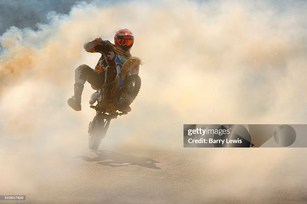 Man Driving A Motorcycle Through Thick Smoke