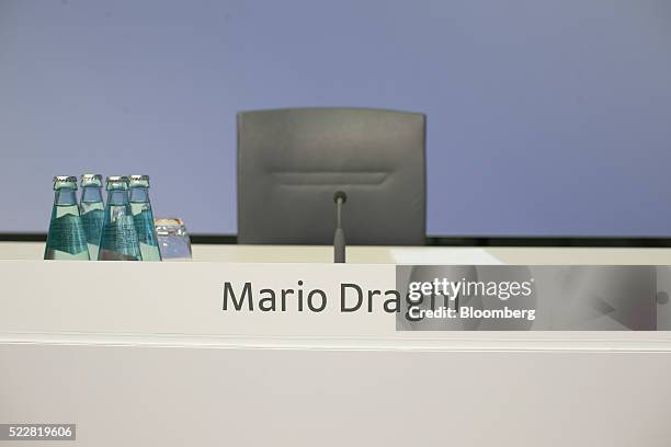 Bottles of water sit on a desk ahead of European Central Bank President Mario Draghi's arrival for a news conference to announce the ECB's interest...