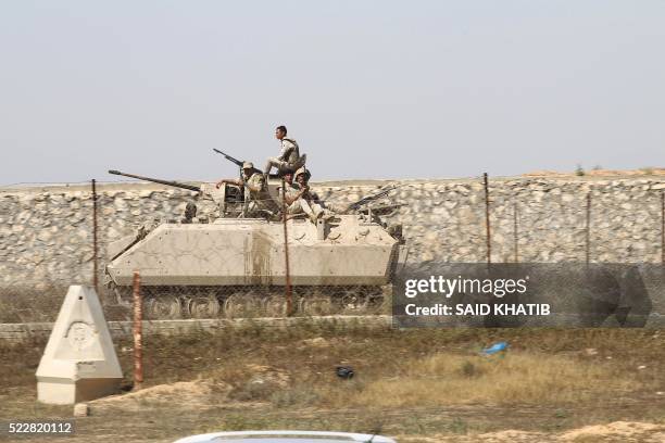Egyptian army forces drive a tank along the border between the Gaza Strip and Egypt at an area where members of the Palestinian Islamist movement...