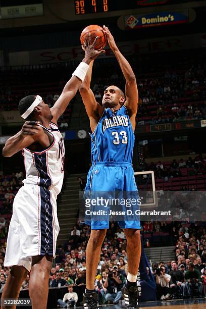 Grant Hill of the Orlando Magic shoots against the New Jersey Nets on March 5, 2005 at the Continental Airlines Arena in East Rutherford, New Jersey....