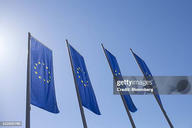 The stars of the European Union sit on banners flying outside the European Central Bank headquarters ahead of ECB President Mario Draghi's news...