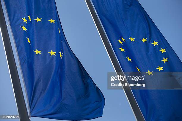 The stars of the European Union sit on banners flying outside the European Central Bank headquarters ahead of ECB President Mario Draghi's news...