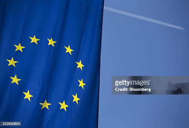 The stars of the European Union sit on a banner flying outside the European Central Bank headquarters ahead of ECB President Mario Draghi's news...