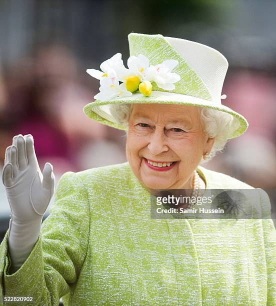 Queen Elizabeth II waves during a walk about around Windsor on her 90th Birthday on April 21, 2016 in Windsor, England.