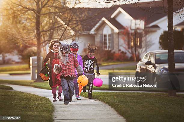 children trick-or-treating - happy halloween stock-fotos und bilder