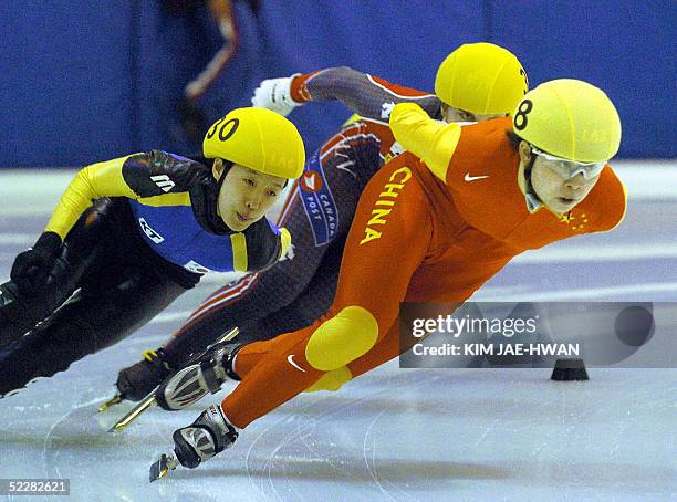 China's Wang Meng leads South Korea's Kang Yun-Mi during the Women's 1,000m Final at the World Short Track Speed Skating Team Championship 2005 at...