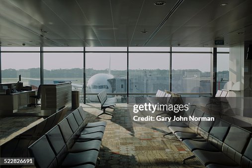 Empty airport lounge with plane outside. Empty airport lounge with plane outside.