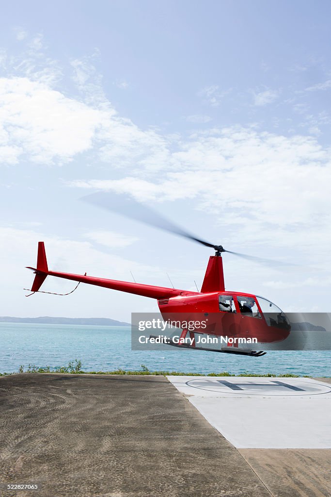 Helicopter leaving island.