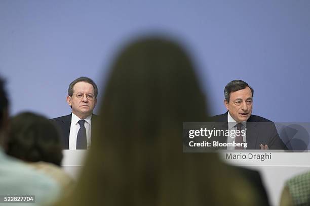 Vitor Constancio, vice president of the European Central Bank, left, looks on as Mario Draghi, president of the European Central Bank , speaks during...