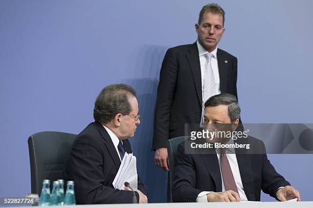 Vitor Constancio, vice president of the European Central Bank, left, speaks with as Mario Draghi, president of the European Central Bank , during a...