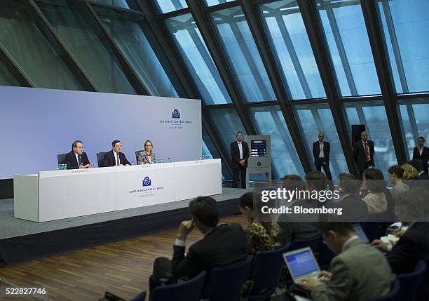 Vitor Constancio, vice president of the European Central Bank, left, speaks as Mario Draghi, president of the European Central Bank , center, and...