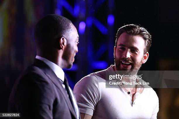 American actors Chris Evans and Anthony Mackie share a moment during the Southeast Asia premiere of Marvel's 'Captain America: Civil War' at Marina...