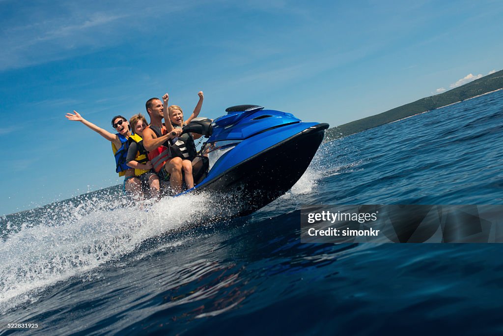 Family Riding A Jet Boat