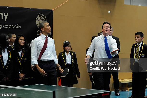 Barack Obama and David Cameron team up to play pupils at table tennis at the Globe Academy school on May 24th in London, United Kingdom. The US...