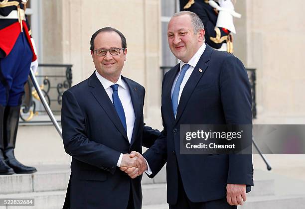 French President Francois Hollande welcomes Georgian President Giorgi Margvelashvili prior to attend a meeting at the Elysee Presidential Palace on...