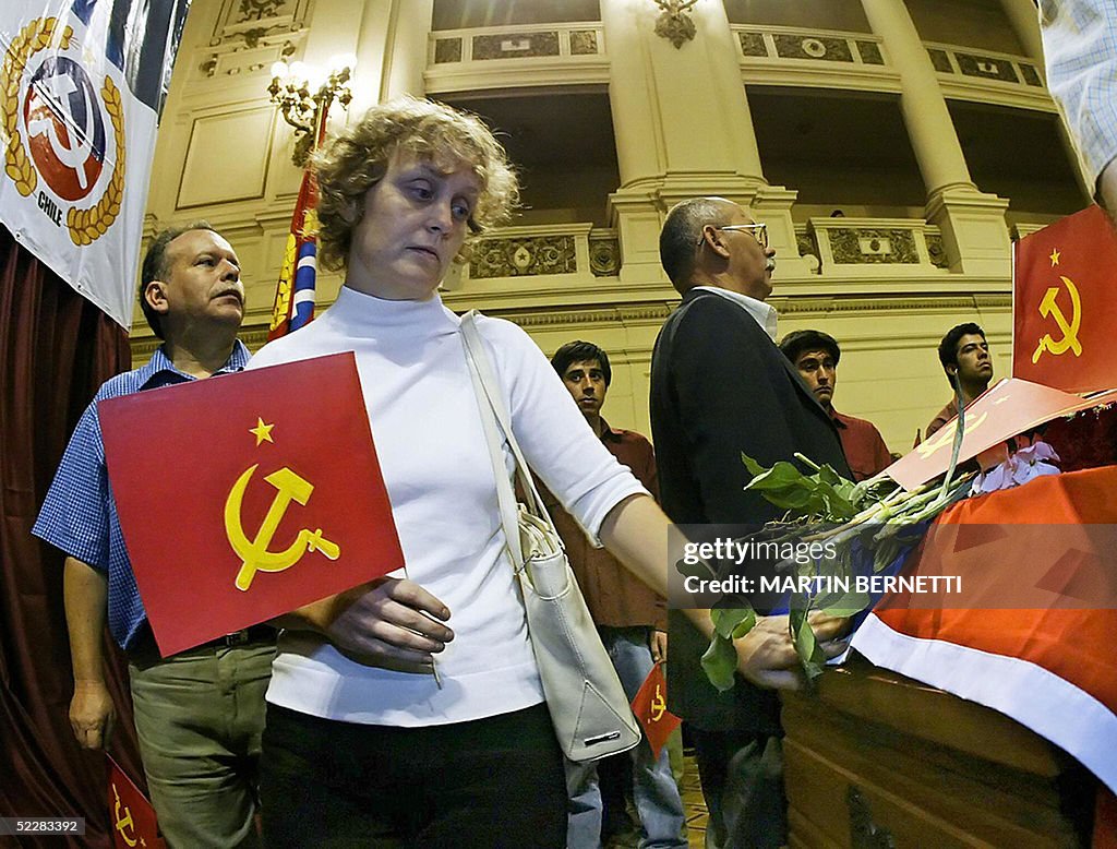 A woman mourns for Gladys Marin, preside