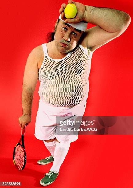 exhausted middle-aged tennis player wiping his brow - vest stock pictures, royalty-free photos & images