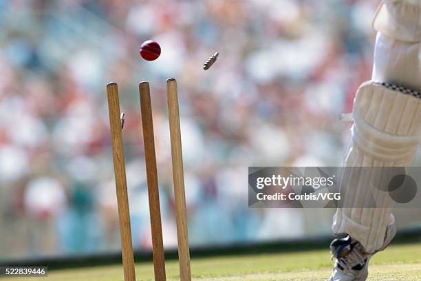 a cricket ball striking the wicket - bail cricket stump stock pictures, royalty-free photos & images
