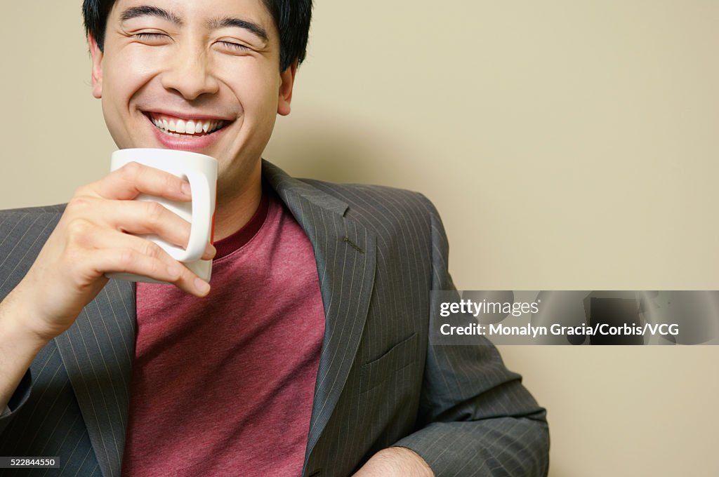 Businessman holding coffee cup