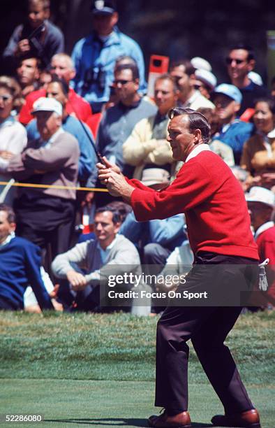 Arnold Palmer follows through his swing circa 1970's.