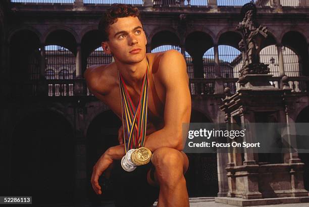 Aleksandr Popov poses for a portrait with his swimming medals from the 1992 Summer Olympics XXV in Barcelona, Spain.