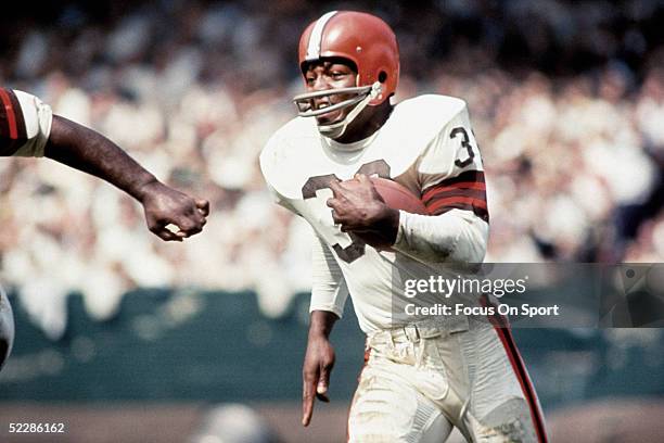 Cleveland Browns' running back Jim Brown runs with the ball. Jim Brown played for the Browns from 1957-1965.