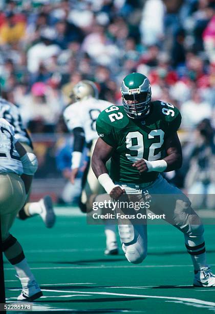 Philadelphia Eagles' Defensive Lineman Reggie White runs during a game in 1991 at Veterans Stadium in Philadelphia, Pennsylvania.