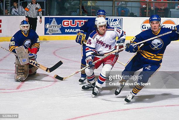 New York Rangers' Anthony Neste breaks through the Buffalo Sabres' defence near the net during a game at Madison Square Garden circa 1980's in New...