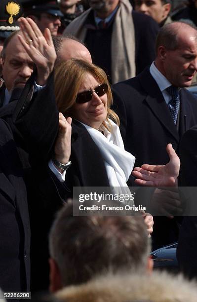 Rosa Maria Calipari waves to the people gathered in Santa Maria Degli Angeli Basilica at the end of the State funeral of her husband Italian...