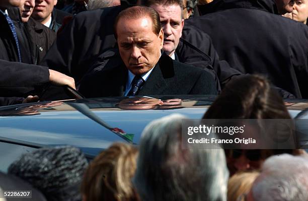 Italian Premier Sivlio Berlusconi, leaves Santa Maria Degli Angeli Basilica at the end of the State funeral of Italian intelligence officer Nicola...