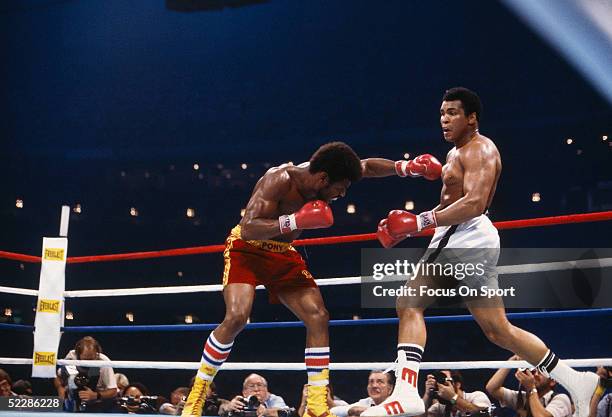 Muhammad Ali backs away from a punch thrown by Leon Spinks during a match at the Superdome on September 15, 1978 in New Orleans, Louisiana.