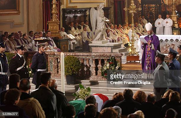 The coffin of killed Italian intelligence officer Nicola Calipari stands at Santa Maria Degli Angeli Basilica during the State funeral on March 7,...