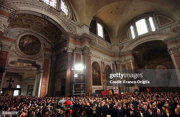 The coffin of killed Italian intelligence officer Nicola Calipari is carried through Santa Maria Degli Angeli Basilica during the State funeral on...