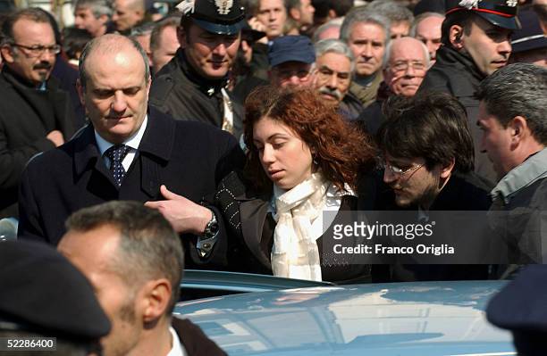 Killed Italian intelligence officer Nicola Calipari's daughter leaves Santa Maria Degli Angeli Basilica at the end of the State funeral on March 7,...
