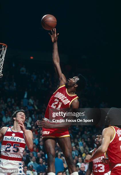 Houston Rockets' center Moses Malone goes up for a shot during a game against the Washington Bullets at Capital Centre circa 1967-77 in Washington,...