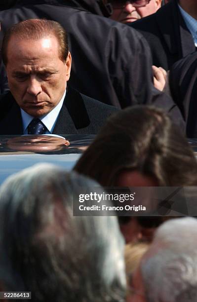 Italian Premier Sivlio Berlusconi leaves Santa Maria Degli Angeli Basilica at the end of the State funeral of Italian intelligence officer Nicola...