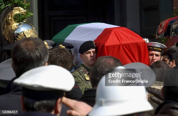 The coffin of killed Italian intelligence officer Nicola Calipari is carried out from Santa Maria Degli Angeli Basilica during the State funeral on...