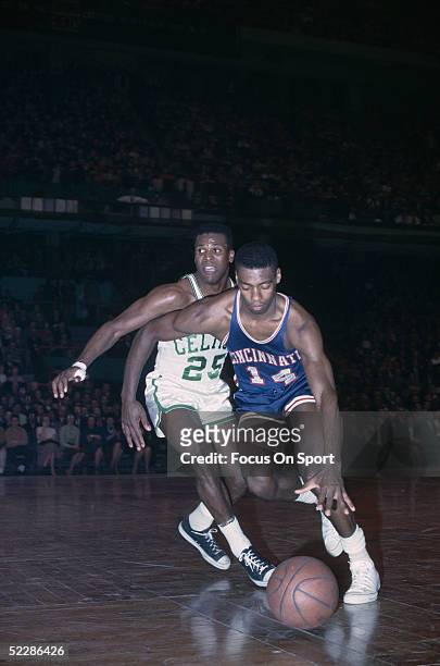 Cincinnati Royals's Oscar Robertson dribbles downcourt against the Boston Celtics during a game in 1964 at the Boston Garden in Boston, Massachusetts.